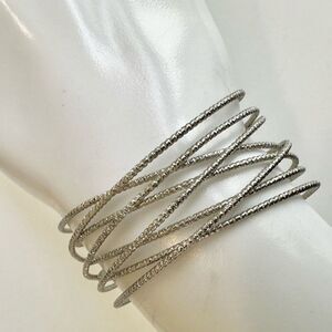 Silver tone open cuff bracelet
